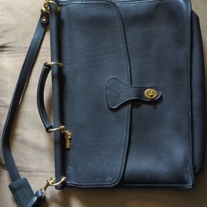 Jack George's black leather messenger bag.
